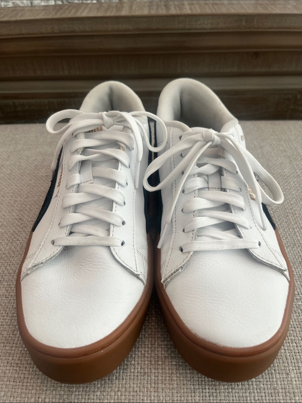 Puma white leather w/ black stripe sneakers, size 8.